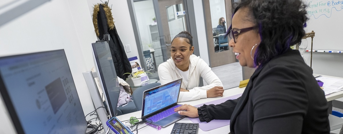 A student meets with an advisor in a newly renovated advising office