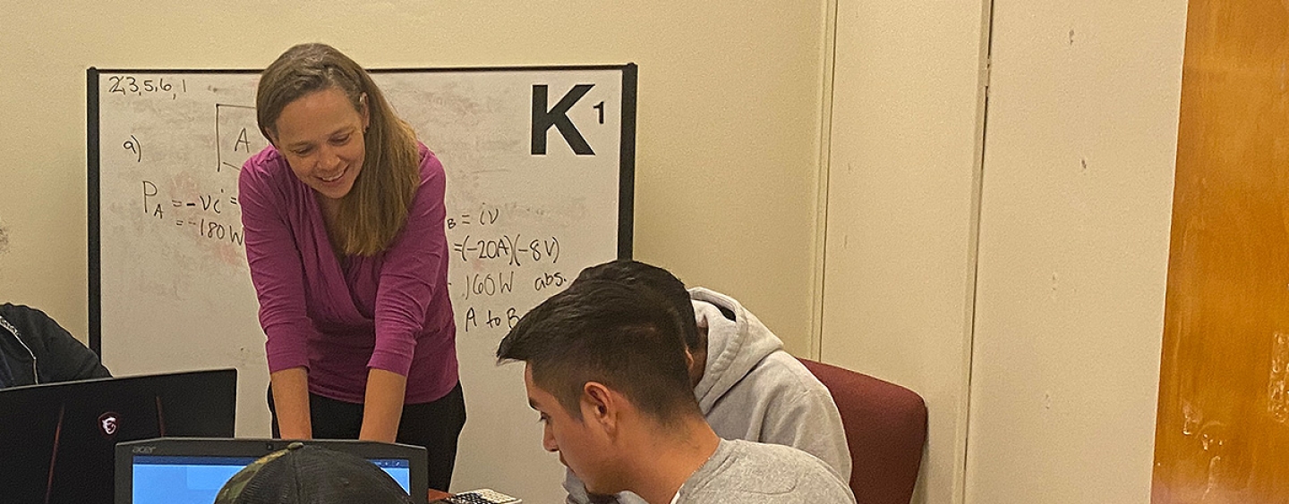 Professor Stephanie Claussen with students during office hours