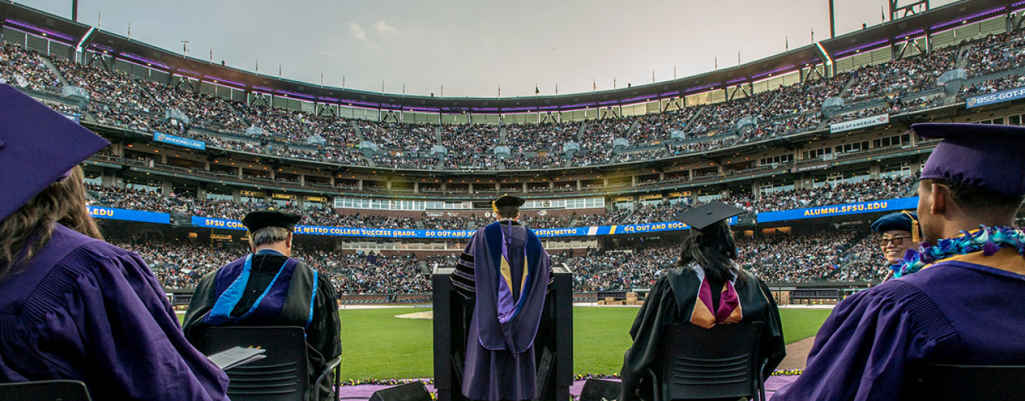A view from the stage at Commencement looking out at a crowded stadium