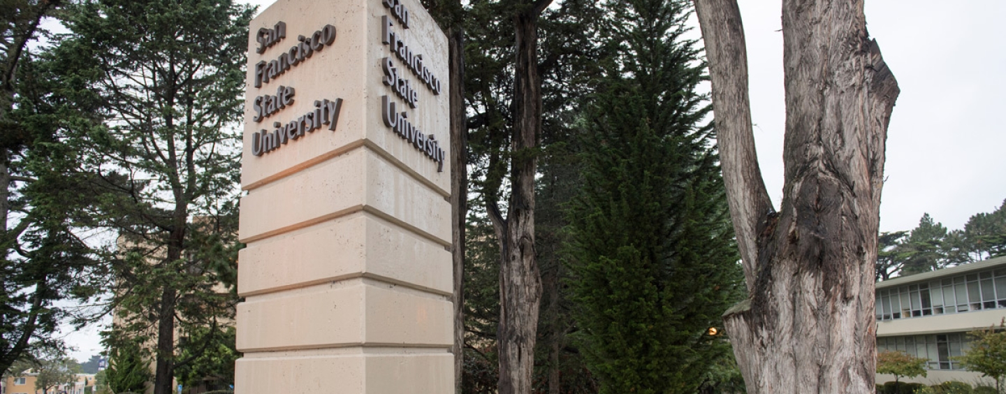 San Francisco State University pylon and trees in the background