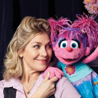 Leslie poses next to the fairy muppet Abby Cadaby