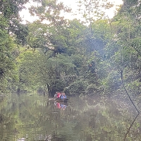 People on a canoe on the Tiputini River