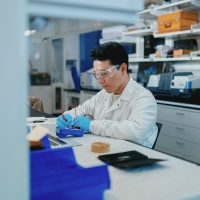 Elmer building electrodes at the lab bench