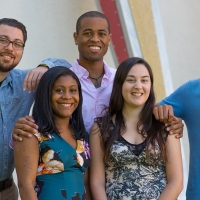 Five students smiling at camera