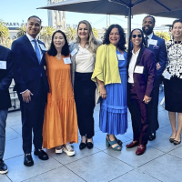 Men and women smile at the Guardian Scholars luncheon