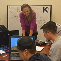 Professor Stephanie Claussen with students during office hours